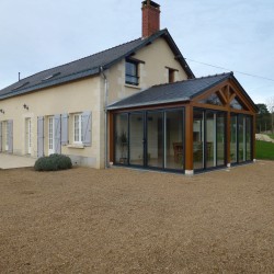 Véranda bois - couverture ardoises naturellesre