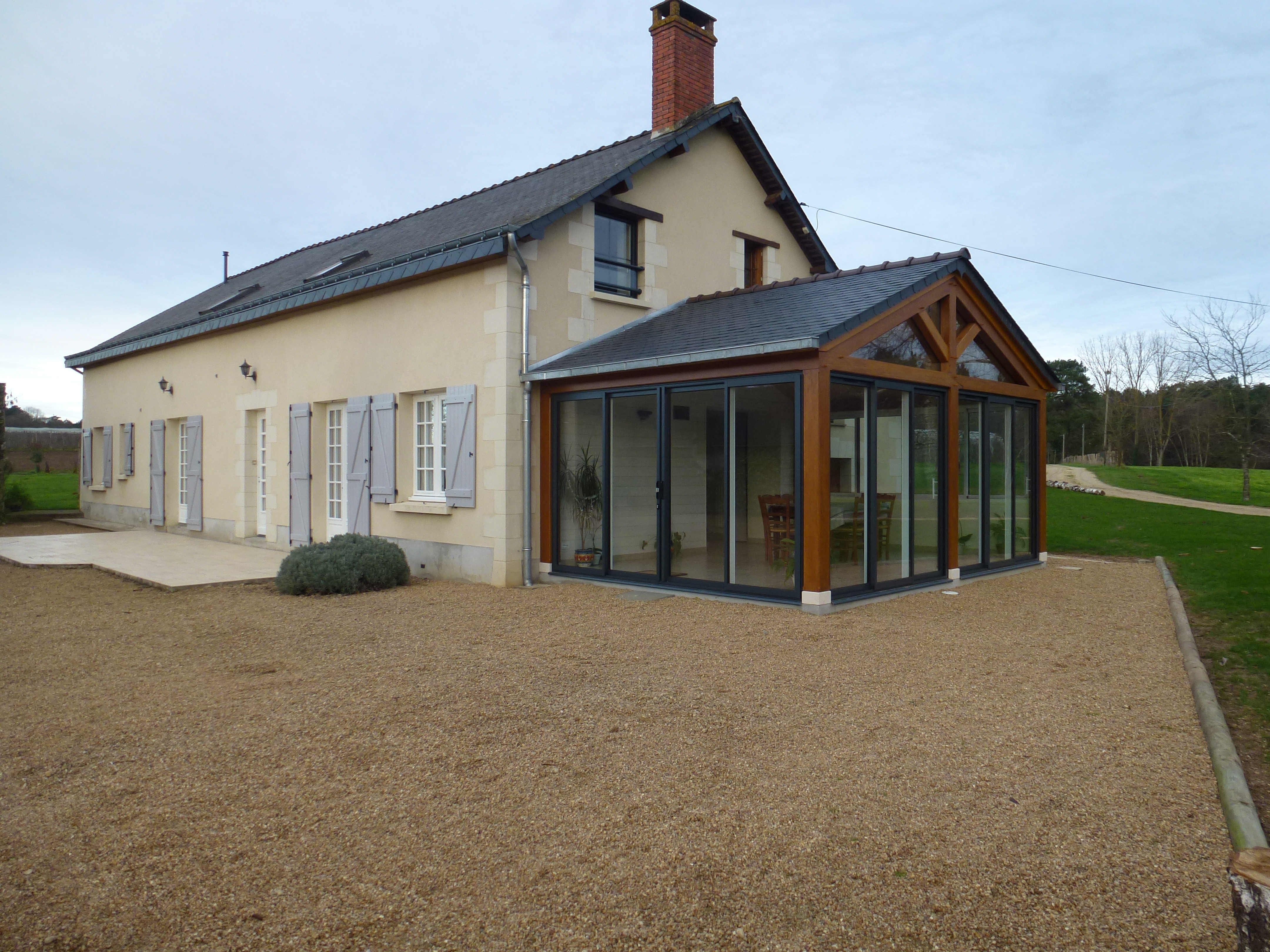 Véranda bois - couverture ardoises naturellesre